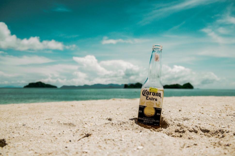 Free Image of Corona beer bottle on a tropical beach 