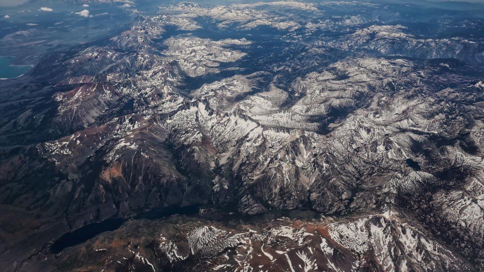 Free Image of Aerial view of snowy mountain ranges 