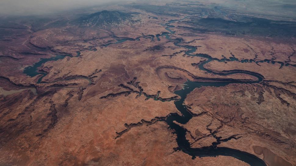 Free Image of Aerial view of river meandering through desert 