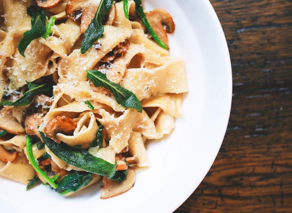 Free Image of Plate of pasta with mushrooms and greens 