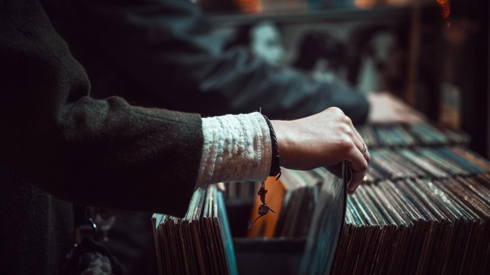 Free Image of Person browsing through vinyl records 