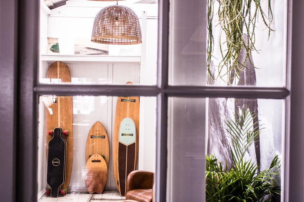 Free Image of Interior view of a cozy corner with skateboards 