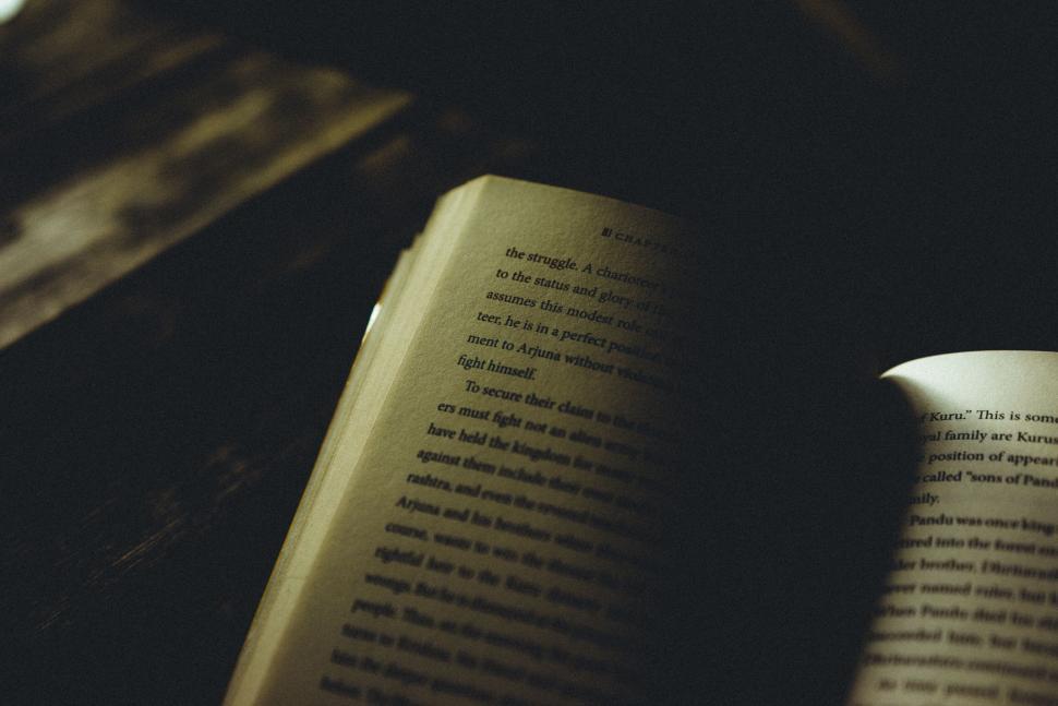 Free Image of Open book in a dark atmospheric setting 