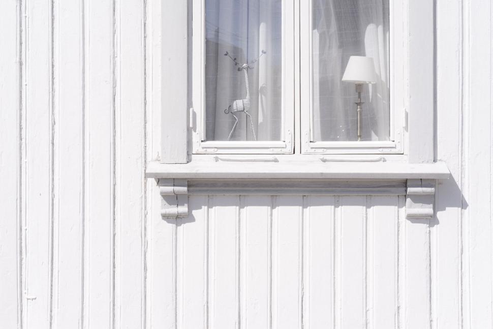 Free Image of Minimalistic white window with lamp inside 