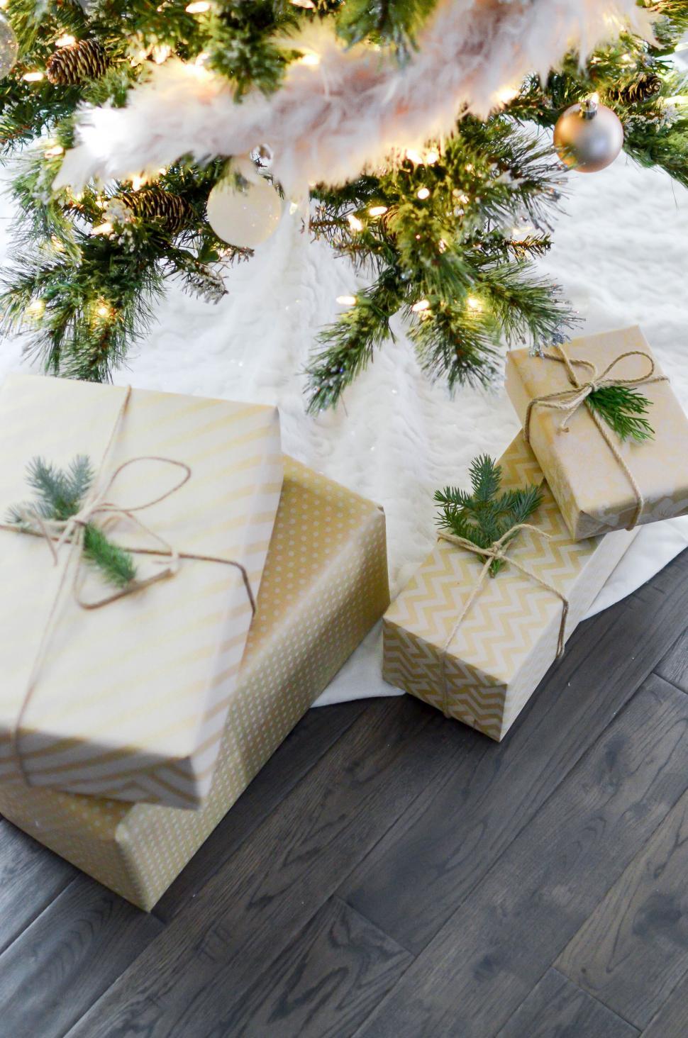 Free Image of Christmas gifts under a decorated tree 