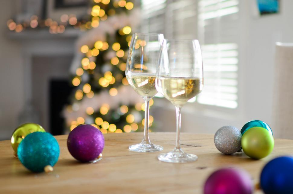 Free Image of Two glasses of white wine with Christmas balls 