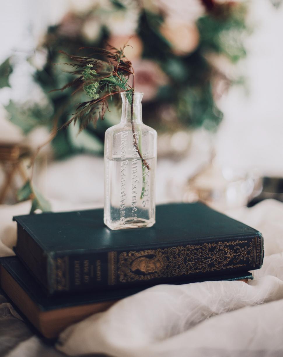 Free Image of Vintage book and glass bottle 