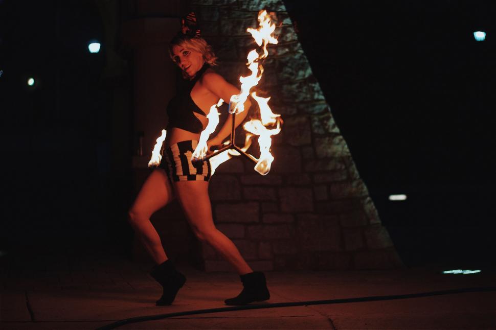 Free Image of Performer with fire prop during night performance 