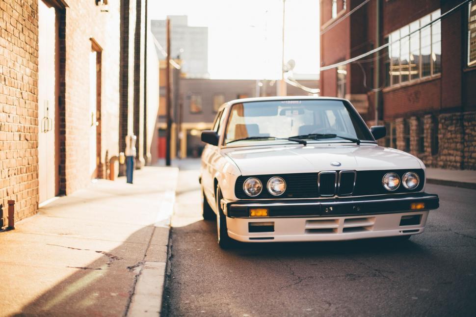 Free Image of Vintage BMW Car on a Sunny Street 