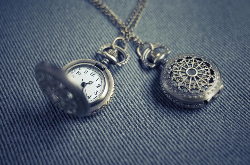 Free Image of Vintage pocket watches on a fabric background 