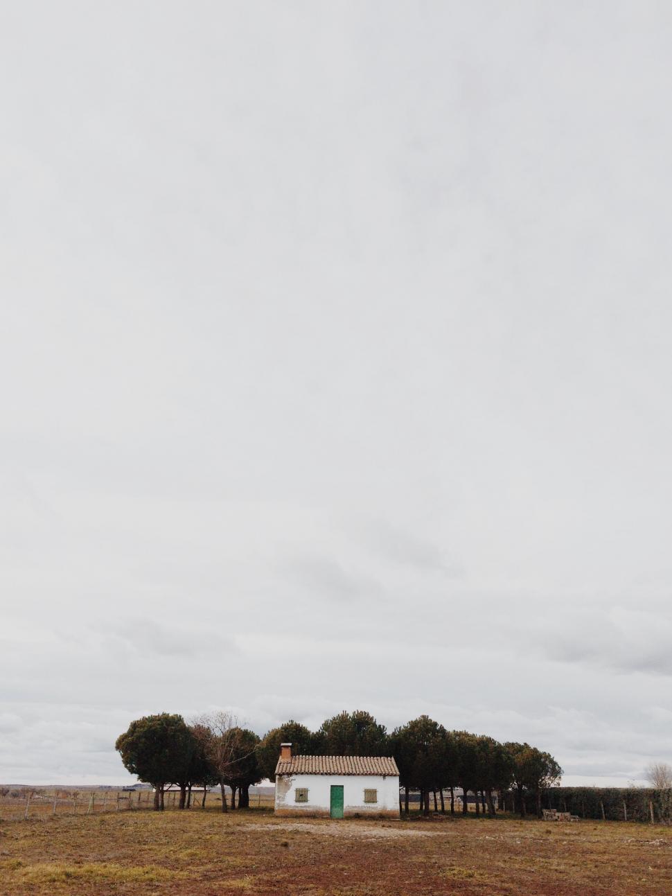 Free Image of Solitary house amidst a serene landscape 