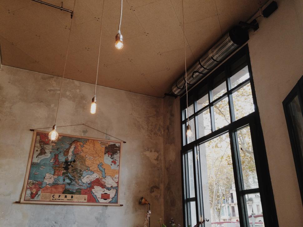 Free Image of Cozy cafe interior with vintage map decor 