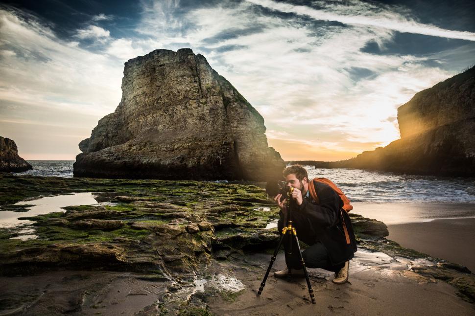 Free Image of Photographer shooting seascape at sunset 