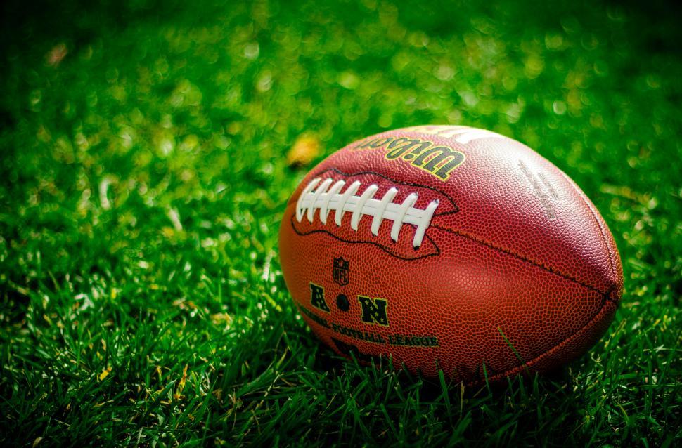 Free Image of Close-up of an American football on grass 