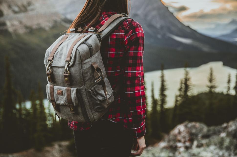 Free Image of Traveler with a backpack looking at mountains 