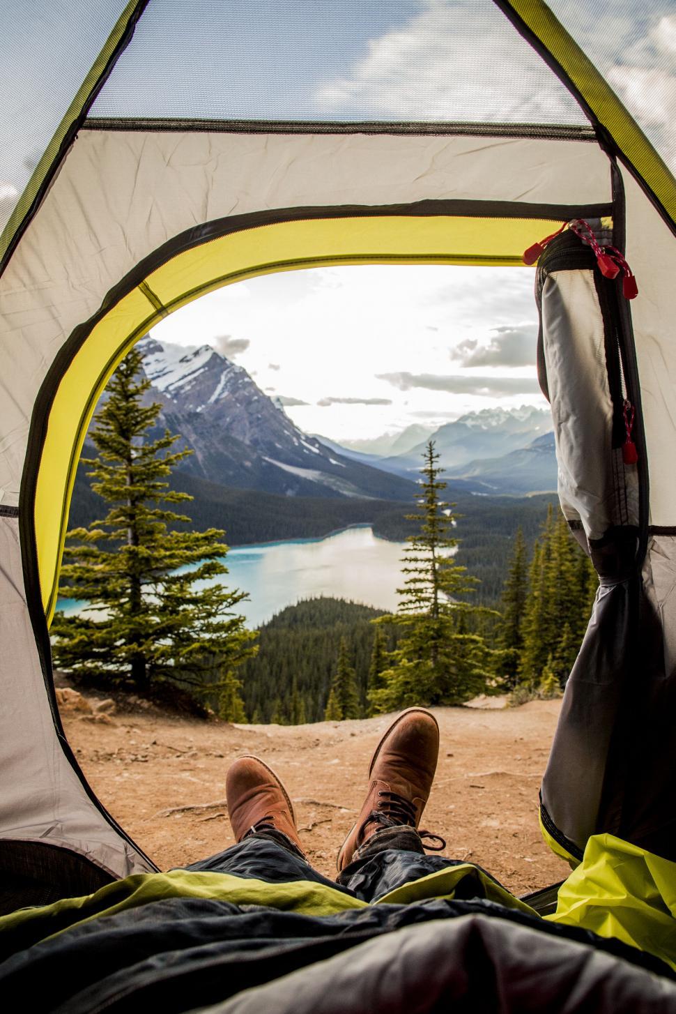 Free Image of View from inside a tent onto a beautiful mountain range 