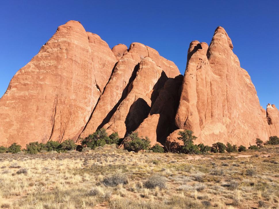 Free Image of Desert rock formations under blue sky in Arches NP 