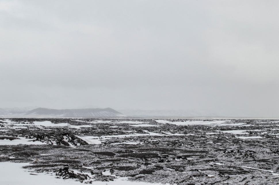 Free Image of Snow-covered vast landscape with cloudy sky 
