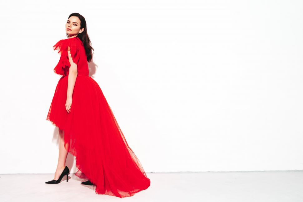 Free Image of A woman in a red dress 