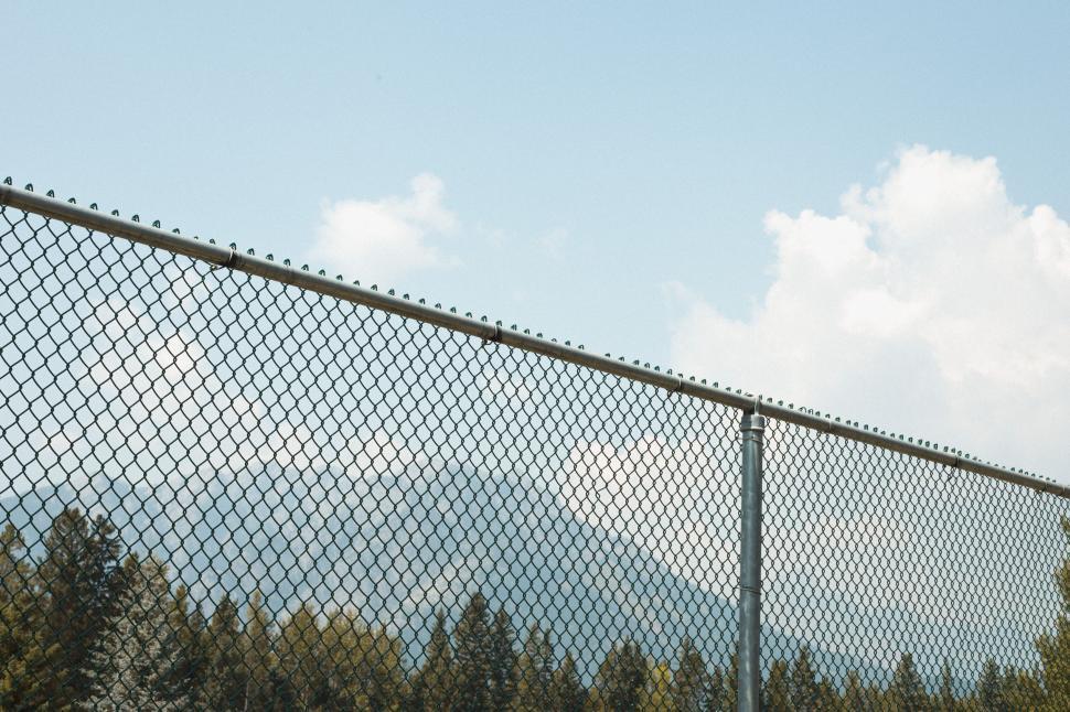 Free Image of Chain-link fence under a clear sky 