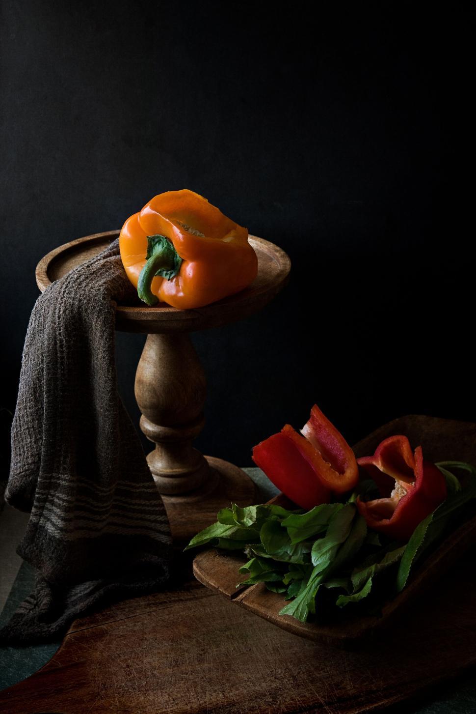 Free Image of Still life with bell peppers on wood 
