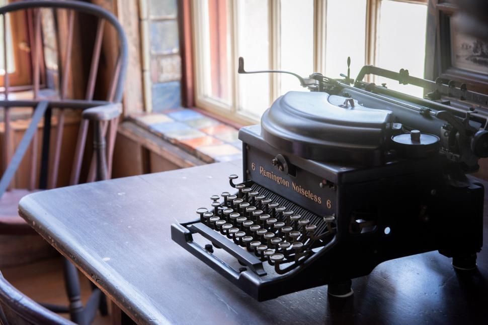 Free Image of Vintage typewriter on an old desk 