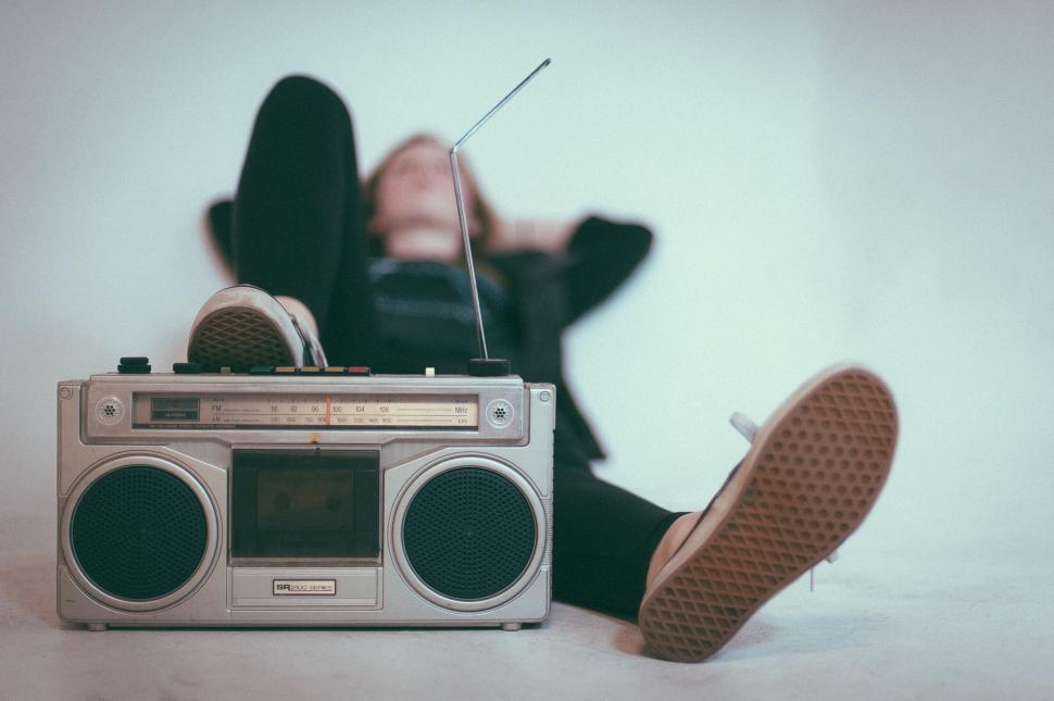 Free Image of Vintage radio and resting person 