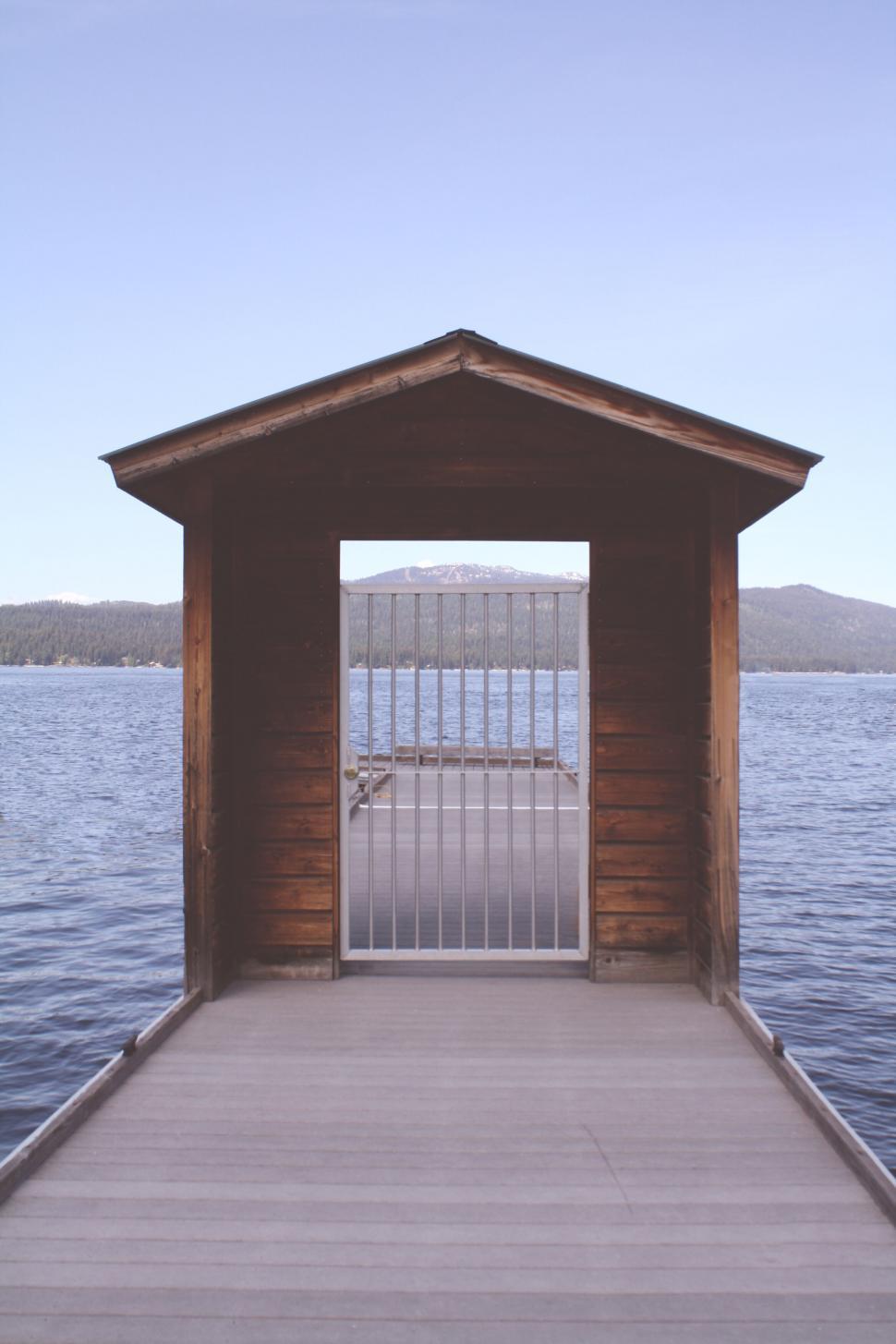 Free Image of Cabin doorway framing a lake view 