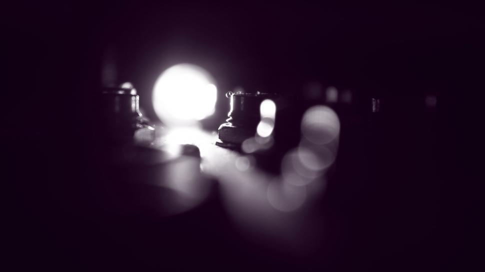 Free Image of Chess pieces in a soft glow on board 
