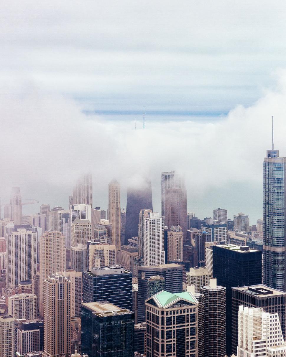 Free Image of Skyline shrouded in fog from aerial view 