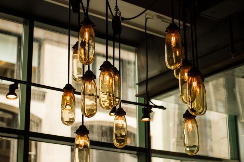 Free Image of Vintage style Edison bulbs hanging in a row 