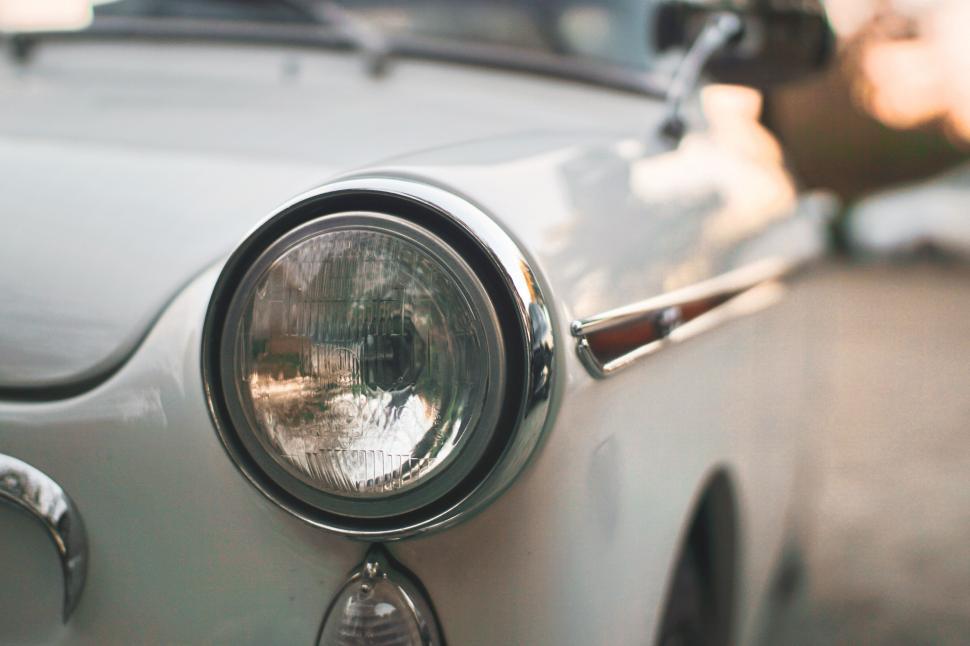 Free Image of Vintage car s headlight and shiny chrome 