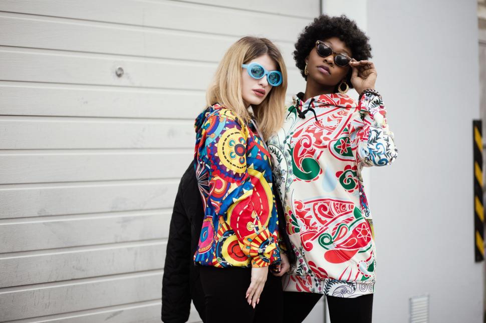 Free Image of Two fashionable women posing outdoors 