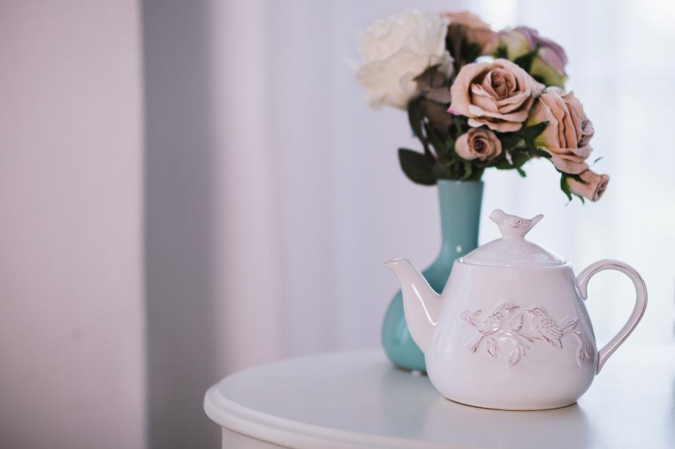 Free Image of Elegant teapot and roses on a side table 
