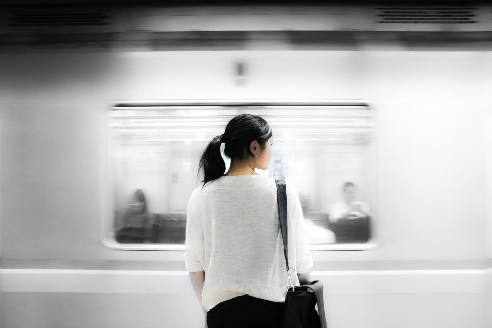 Free Image of Woman waiting alone for a train 