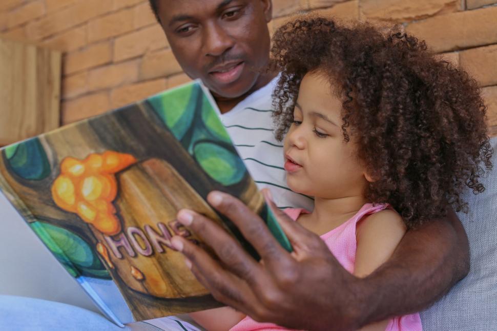 Free Image of Father reading book with daughter 