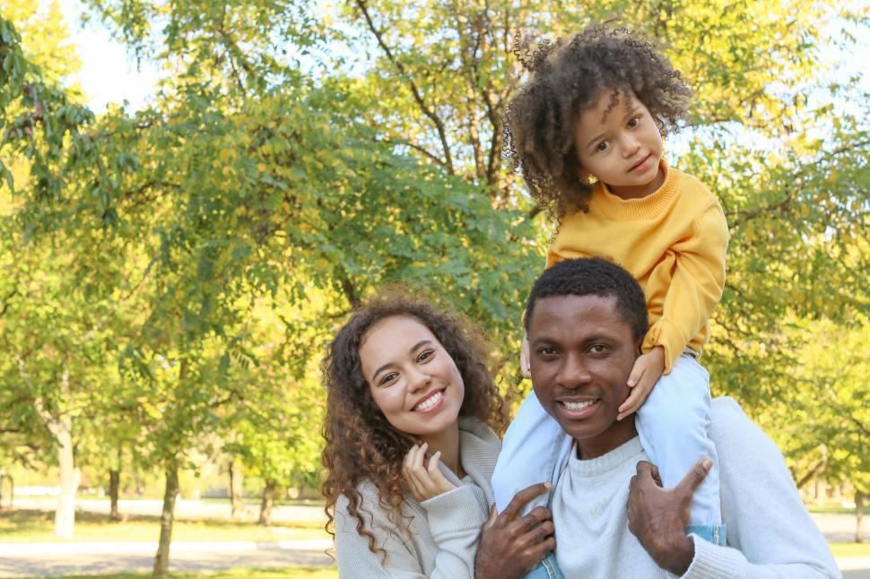 Free Image of Happy family in park during fall season 