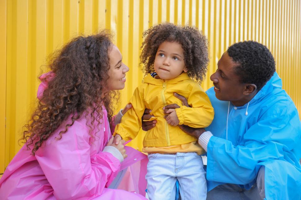 Free Image of Family with child wearing colorful jackets 