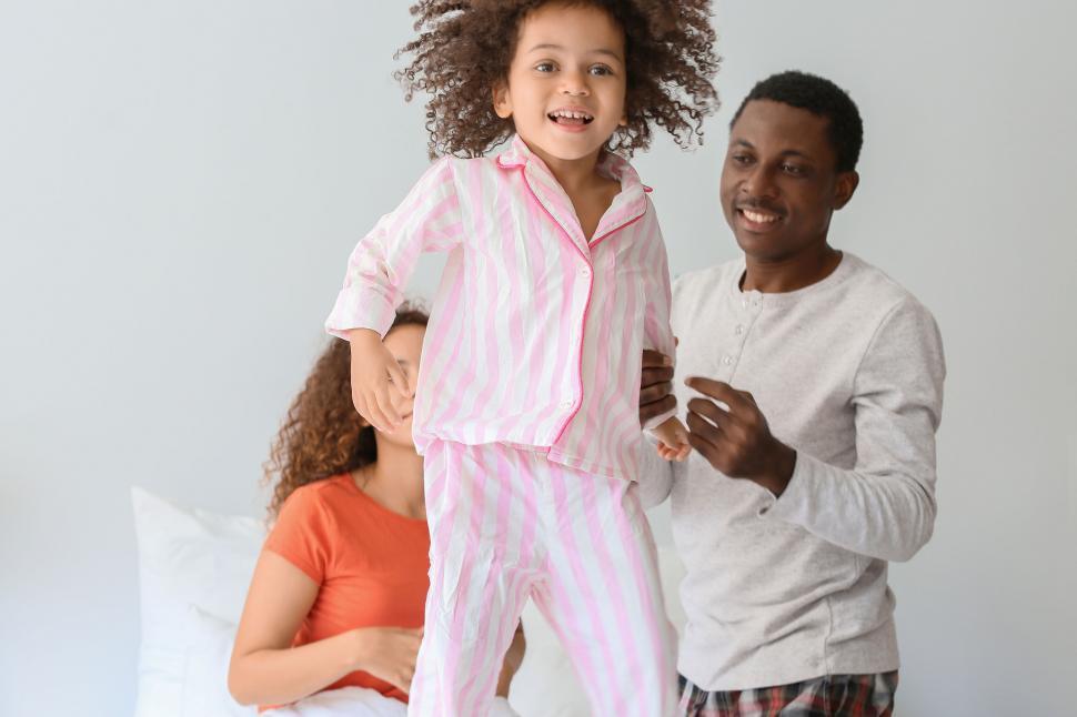Free Image of Playtime in the bedroom with family 