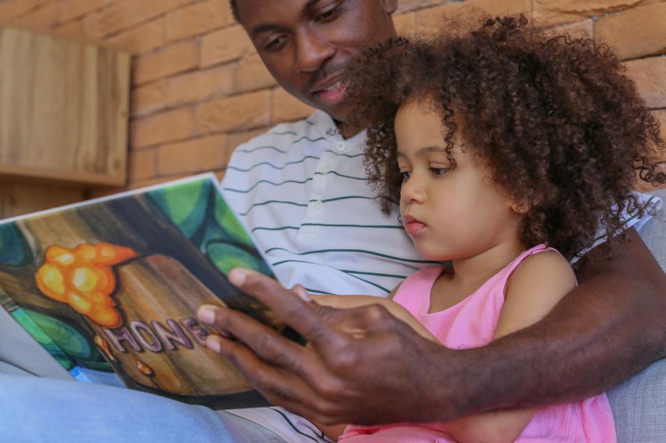 Free Image of Father reading book with daughter 