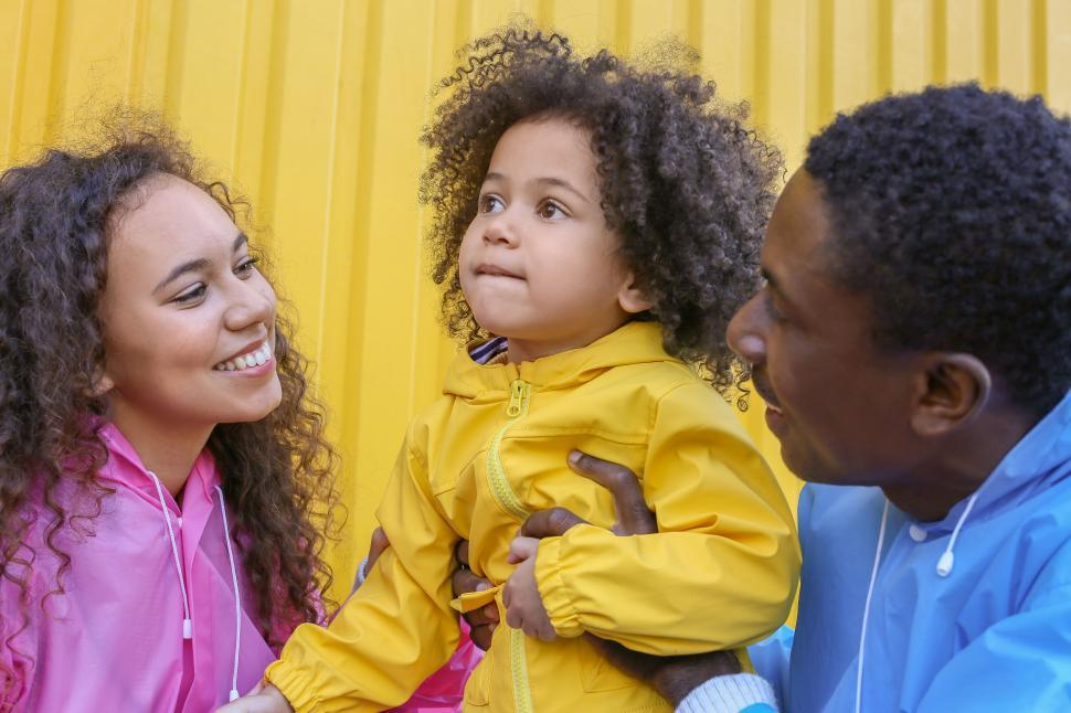 Free Image of Family moment with child and colorful attire 
