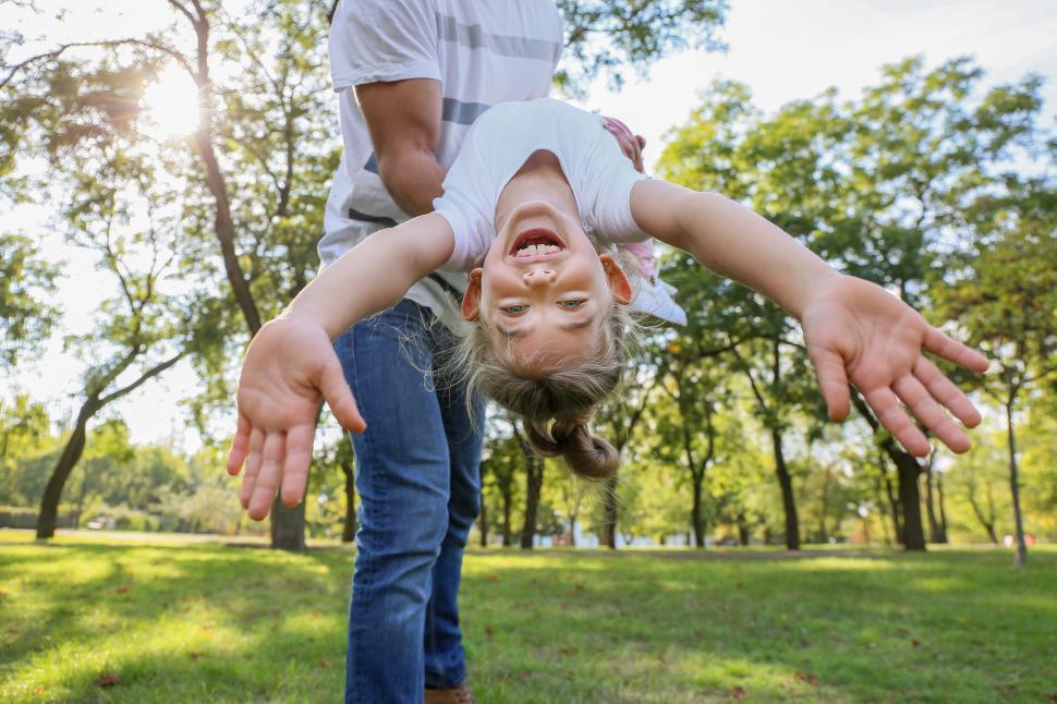 Free Image of Child playing airplane with parent 