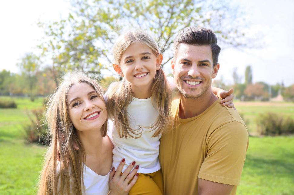 Free Image of Family portrait with smiling daughter embraced 