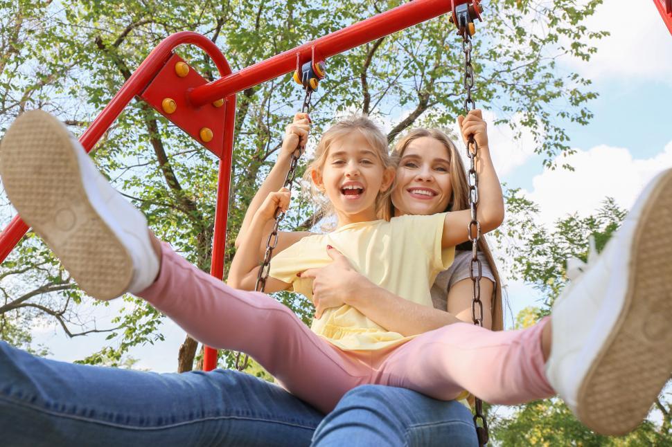 Free Image of Joyful swing ride with mother and daughter 