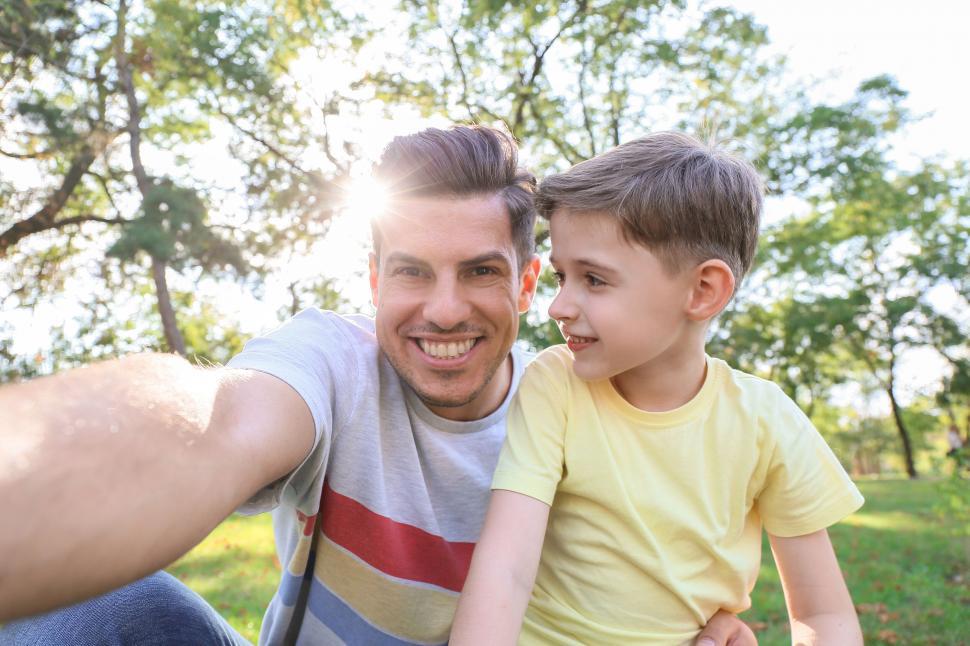 Free Image of Father and son taking selfie in park 