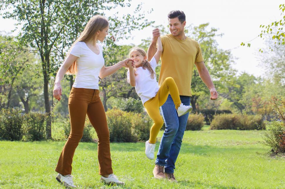 Free Image of Family in a playful chase in the park 