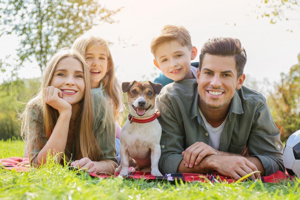 Free Image of Family on a picnic with their dog 