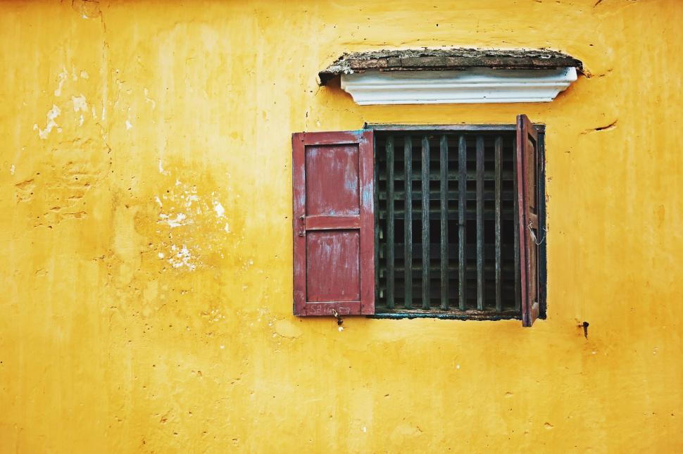 Free Image of Weathered yellow wall with window 