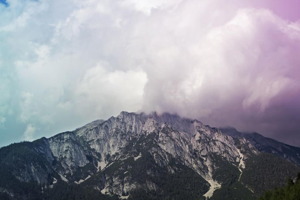 Free Image of Majestic mountain peak obscured by clouds 