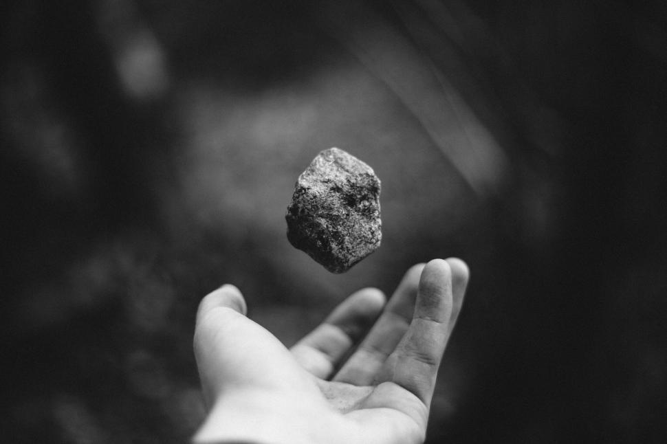 Free Image of Floating rock in mid-air over hand 